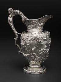 An American Baroque Style Repousse Silver Pitcher