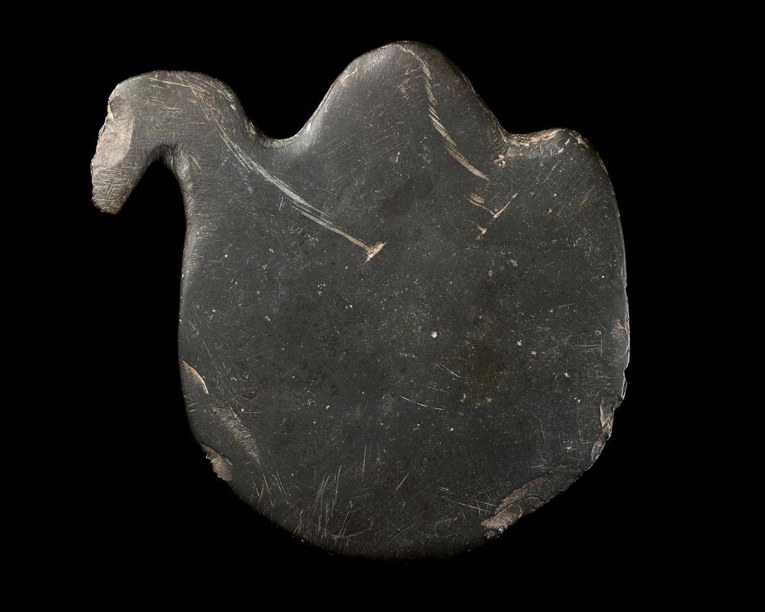 An Egyptian Greywacke Cosmetic Palette in the Form of a Bird