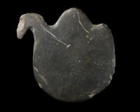 An Egyptian Greywacke Cosmetic Palette in the Form of a Bird