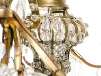 A Pair of French Gilt Bronze and Glass-Beaded Twelve-Light Chandeliers