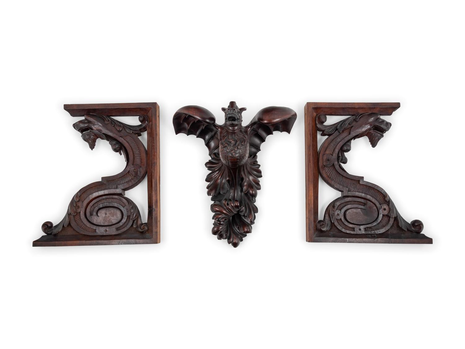Three Continental Carved Walnut Griffin Form Brackets