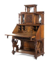 A Renaissance Revival Carved Oak Slant-Front Bureau