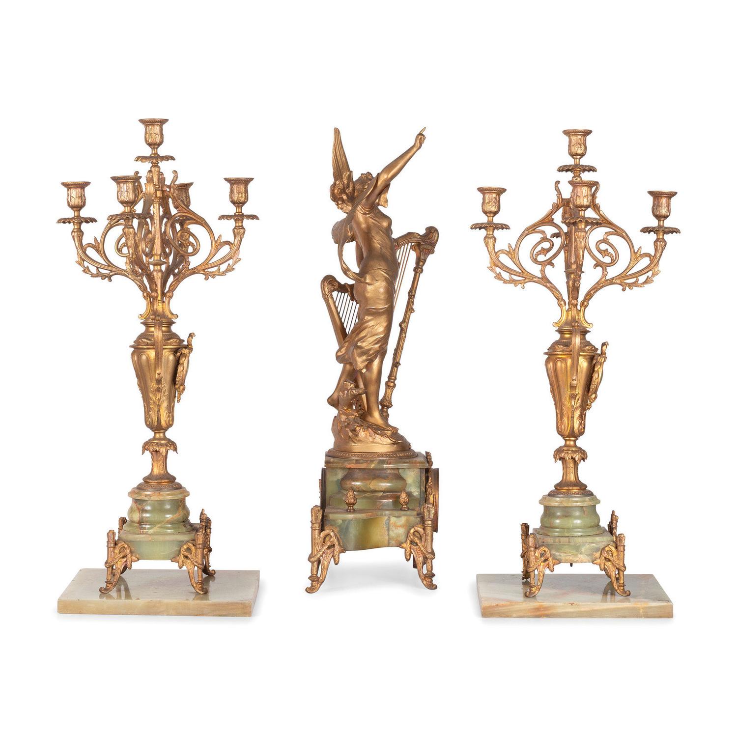 A Neoclassical Gilt Metal and Onyx Clock Garniture