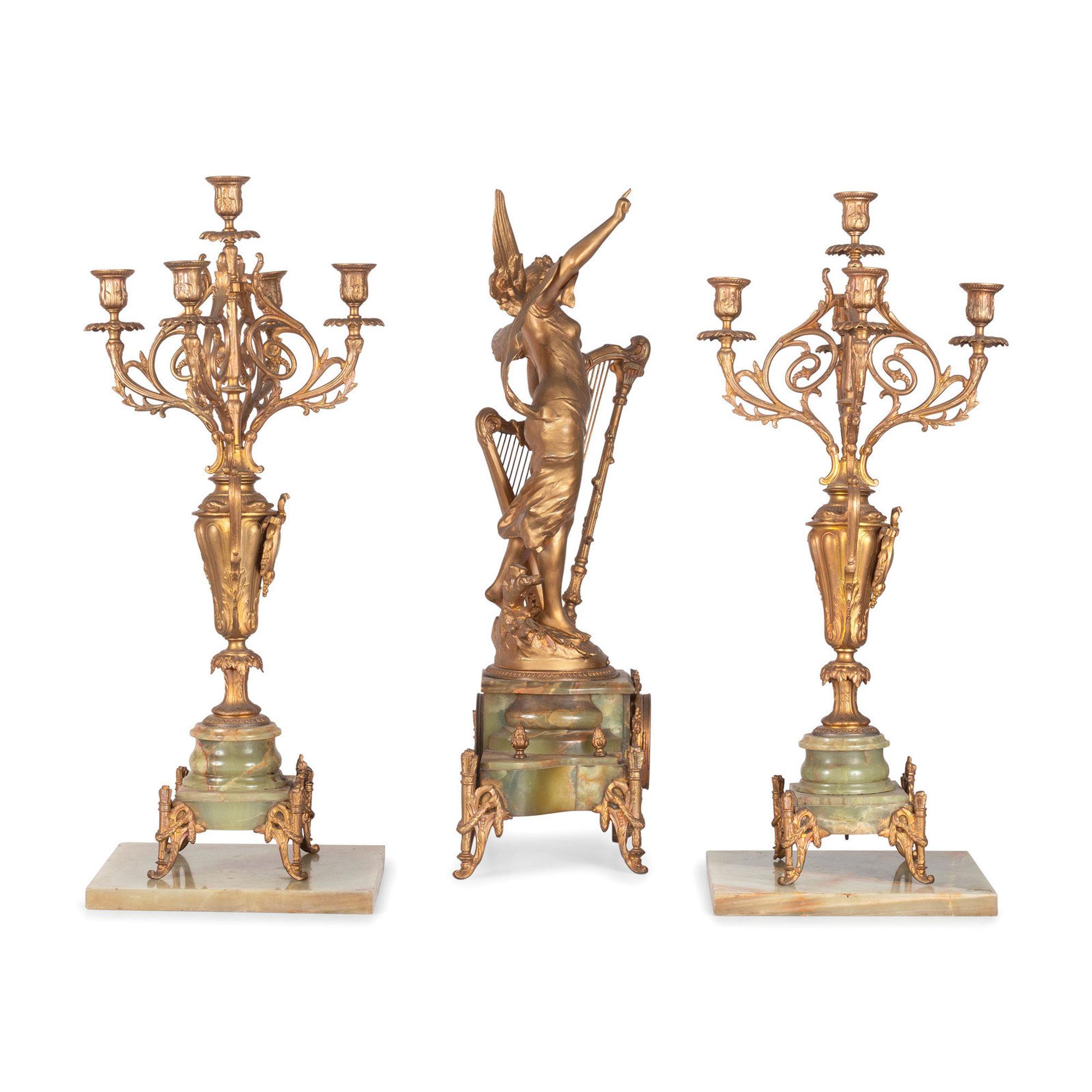 A Neoclassical Gilt Metal and Onyx Clock Garniture