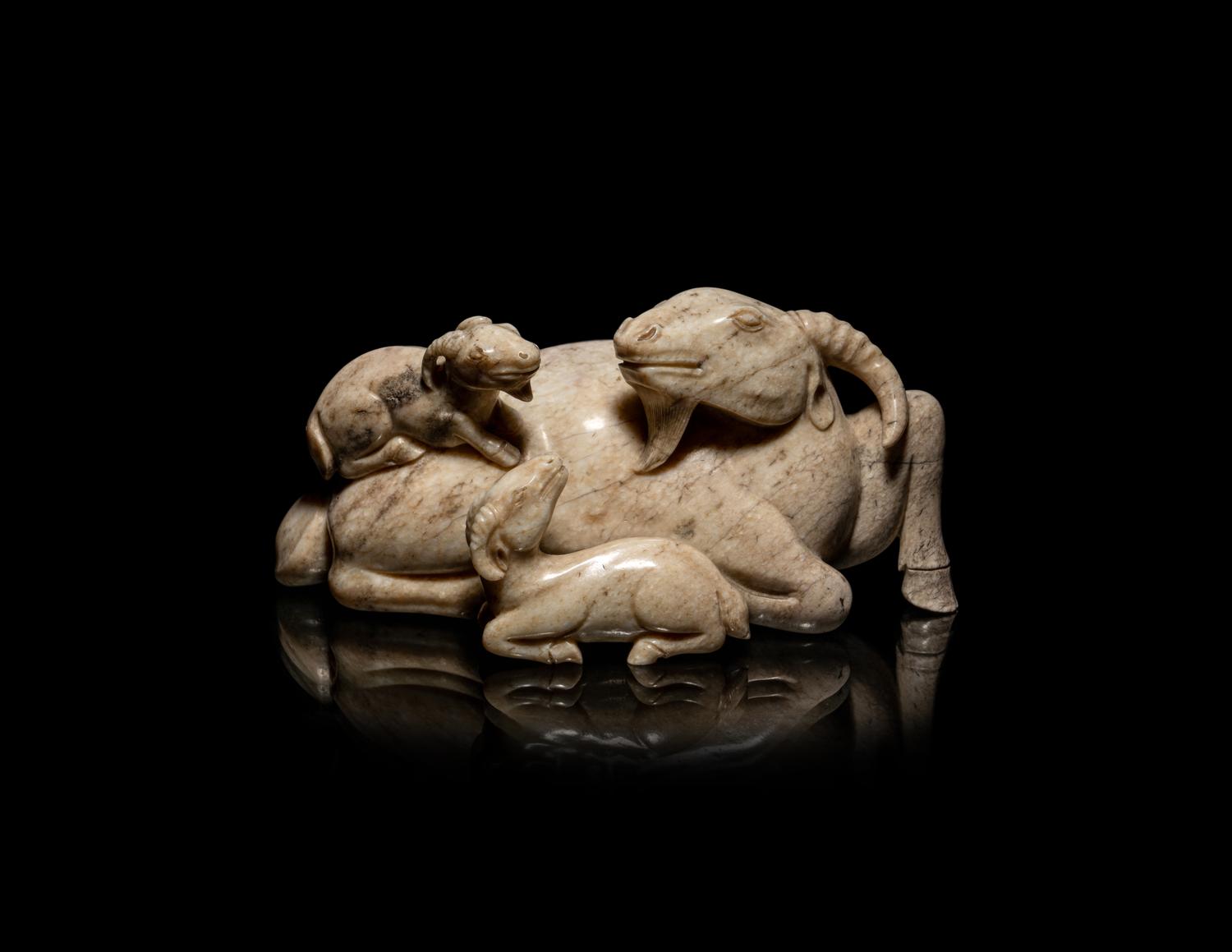 A Chinese Chicken Bone Jade Figural 'Three Rams' Group