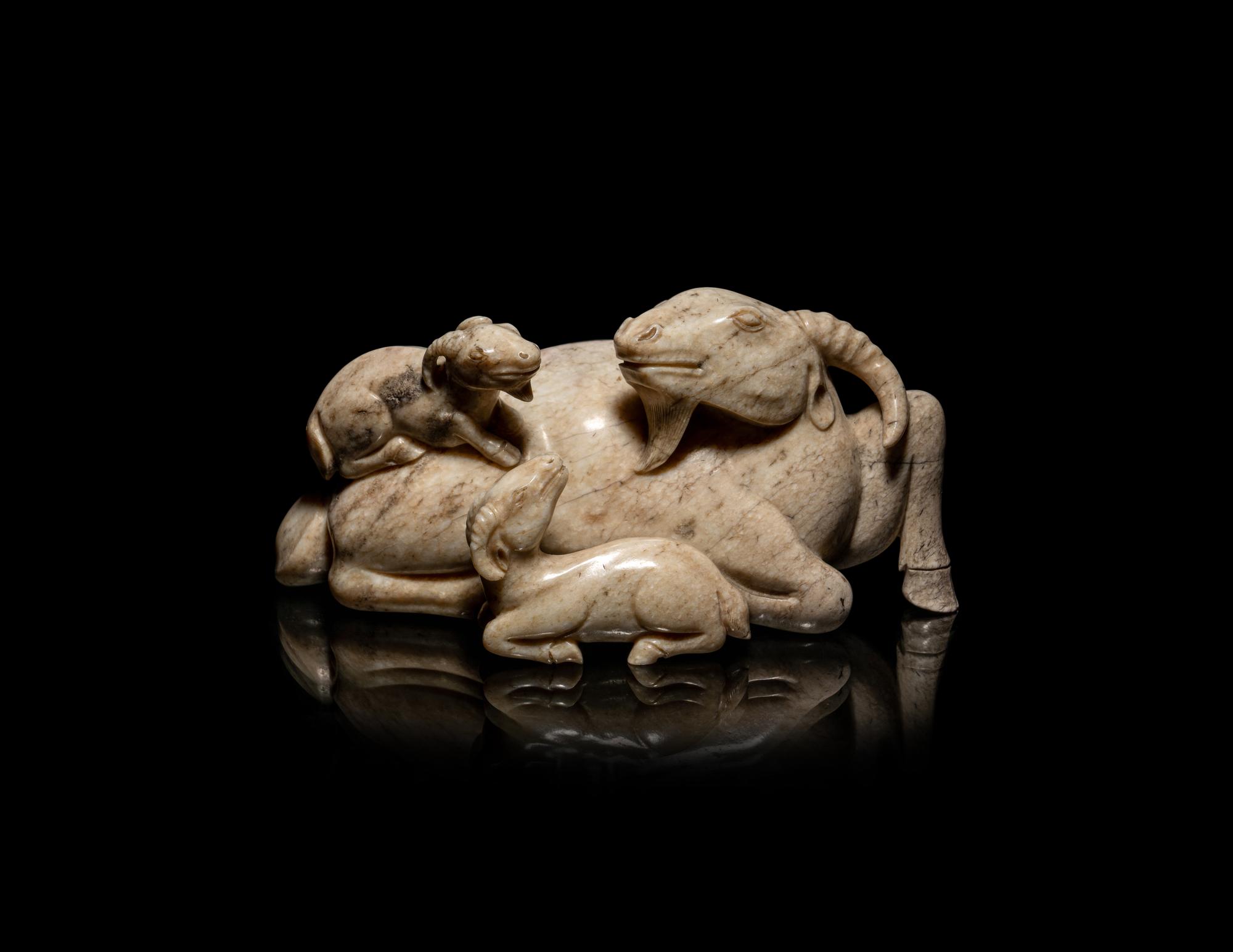 A Chinese Chicken Bone Jade Figural 'Three Rams' Group