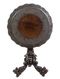 An Anglo-Indian Carved Hardwood Tilt-Top Table Height 30 3/4 x diameter 28 1/4 inches. — LATE 19TH/EARLY 20TH CENTURY