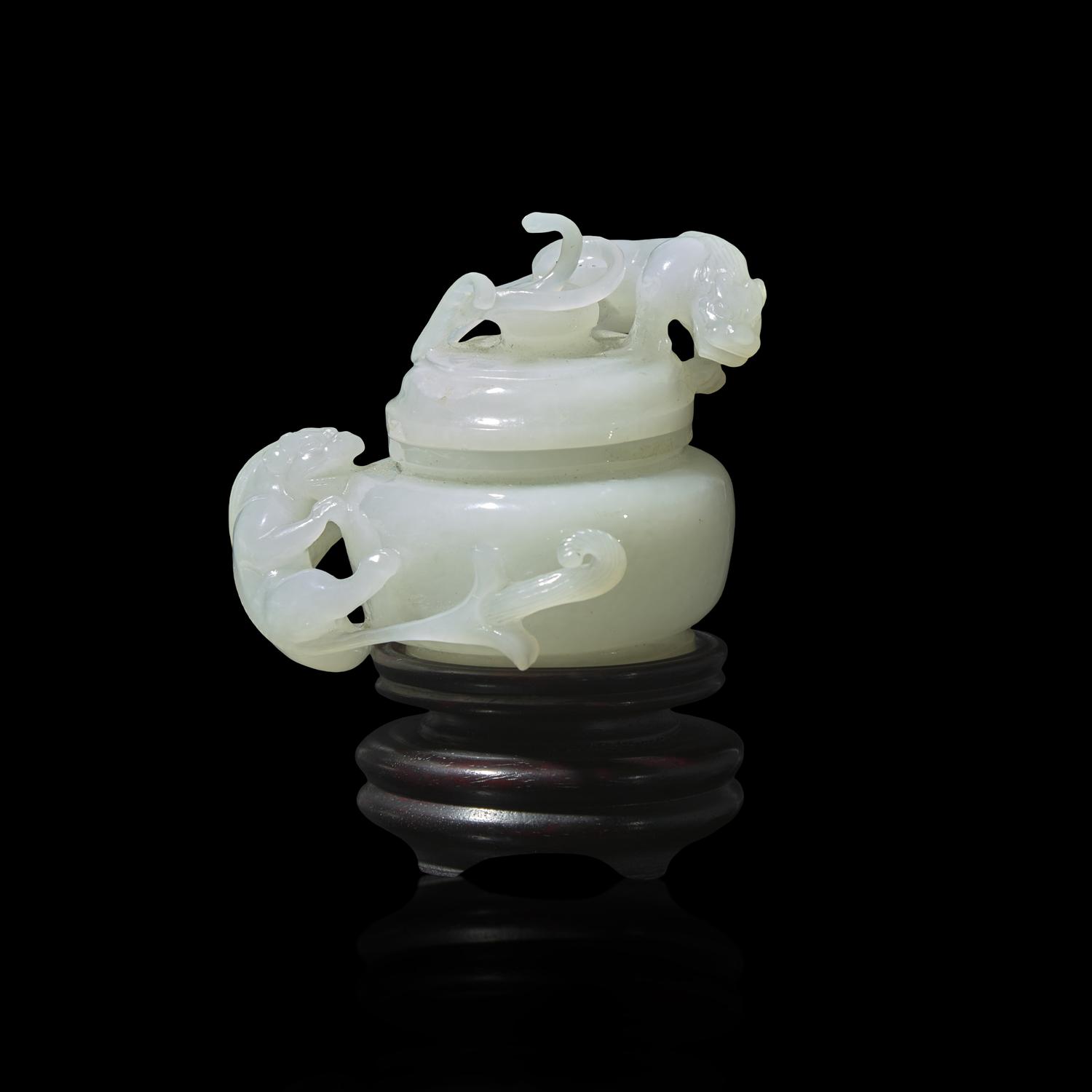 A Small Chinese Carved White Jade ' Qilong' Covered Jar 白玉螭龍蓋罐
