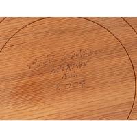 A Turned and Segmented Wood Vase in the style of Ray Allen