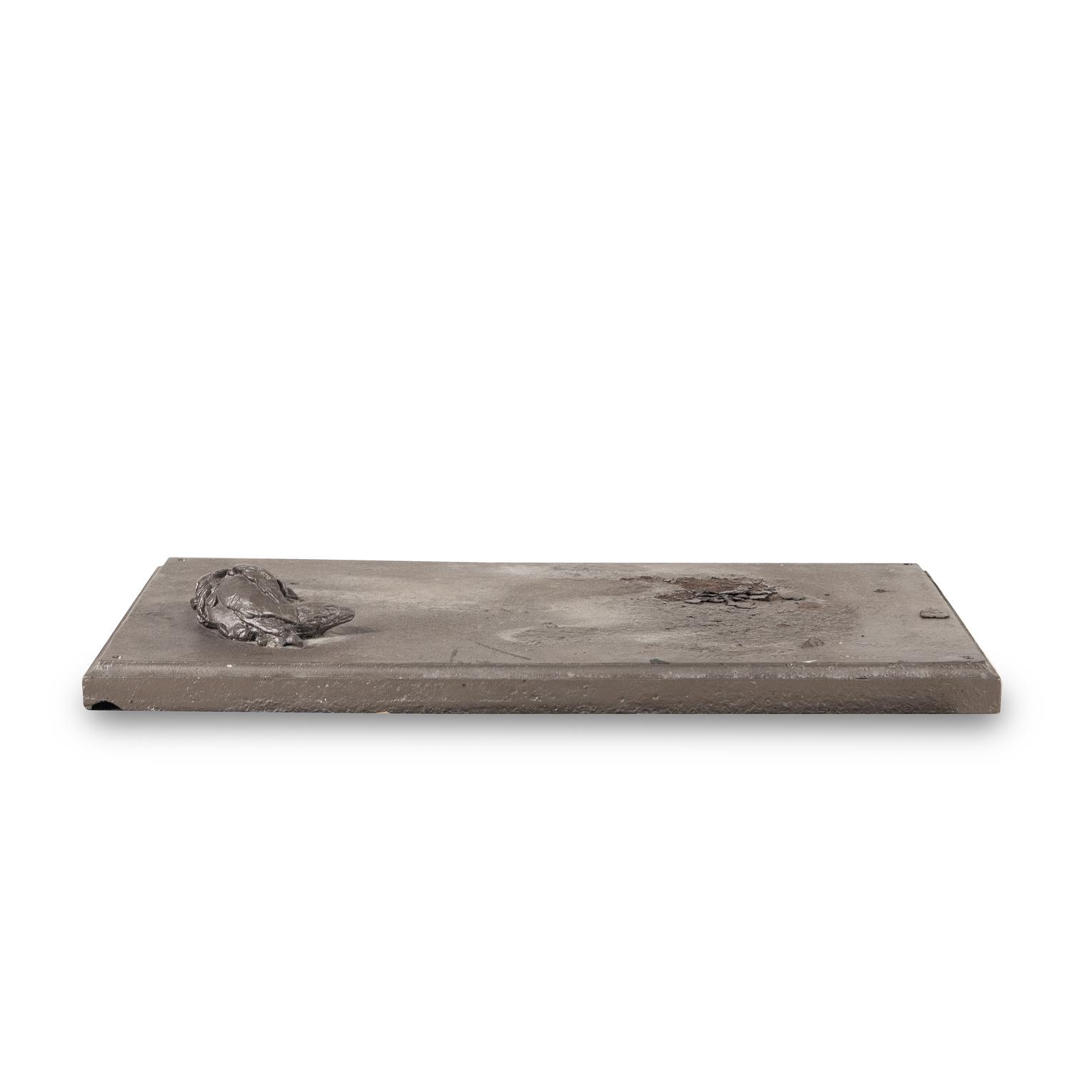 A Cast Iron Sculpture of a Dog