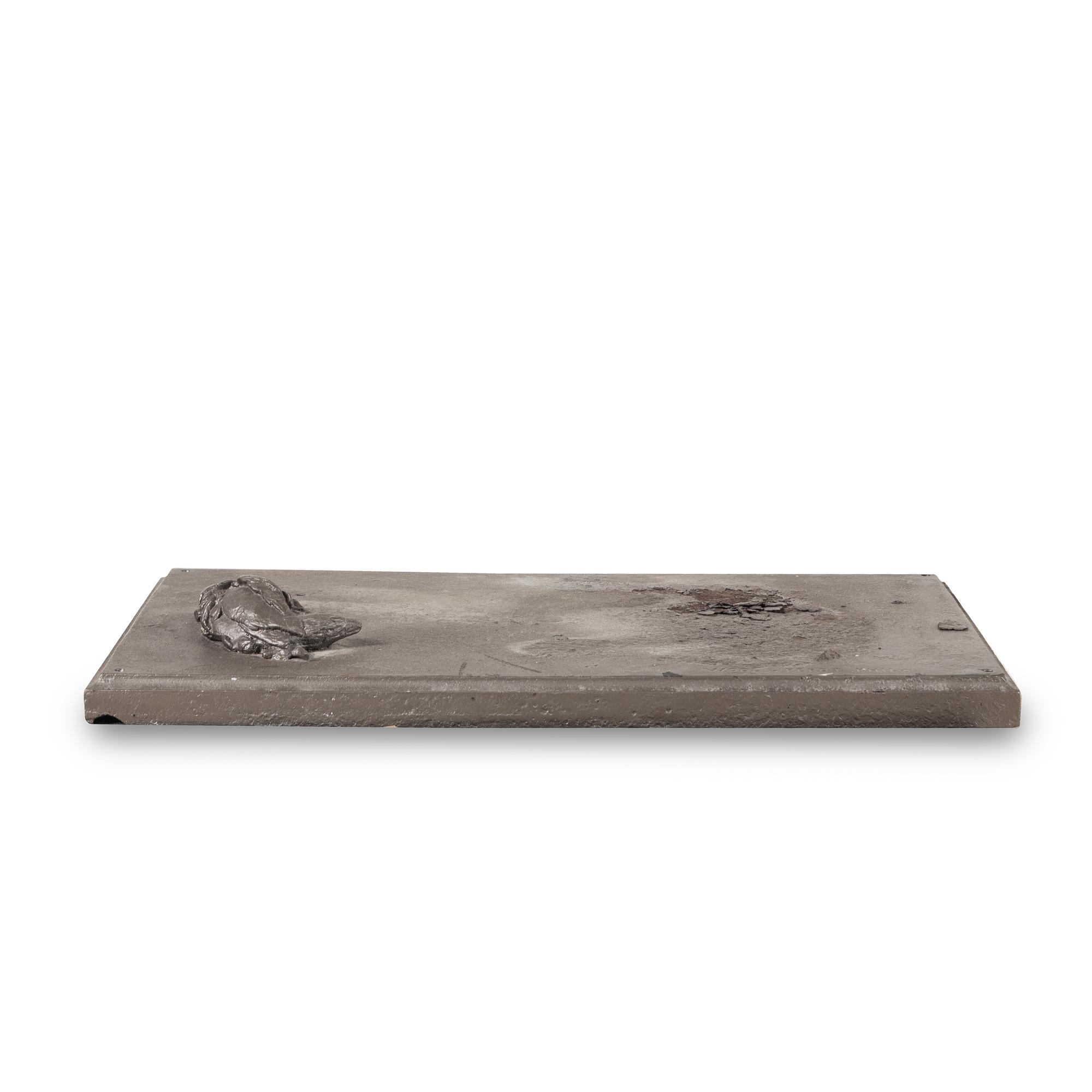 A Cast Iron Sculpture of a Dog