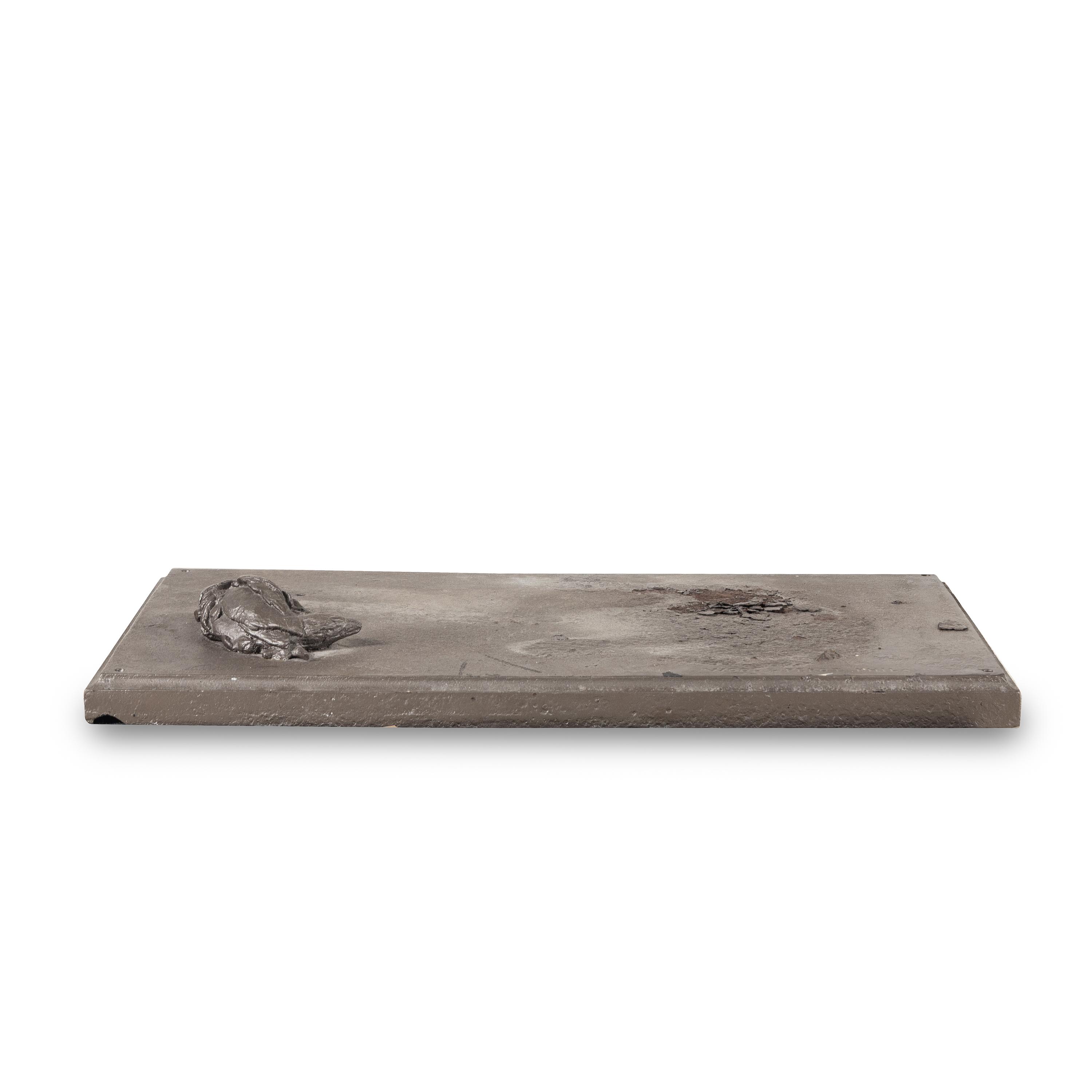 A Cast Iron Sculpture of a Dog