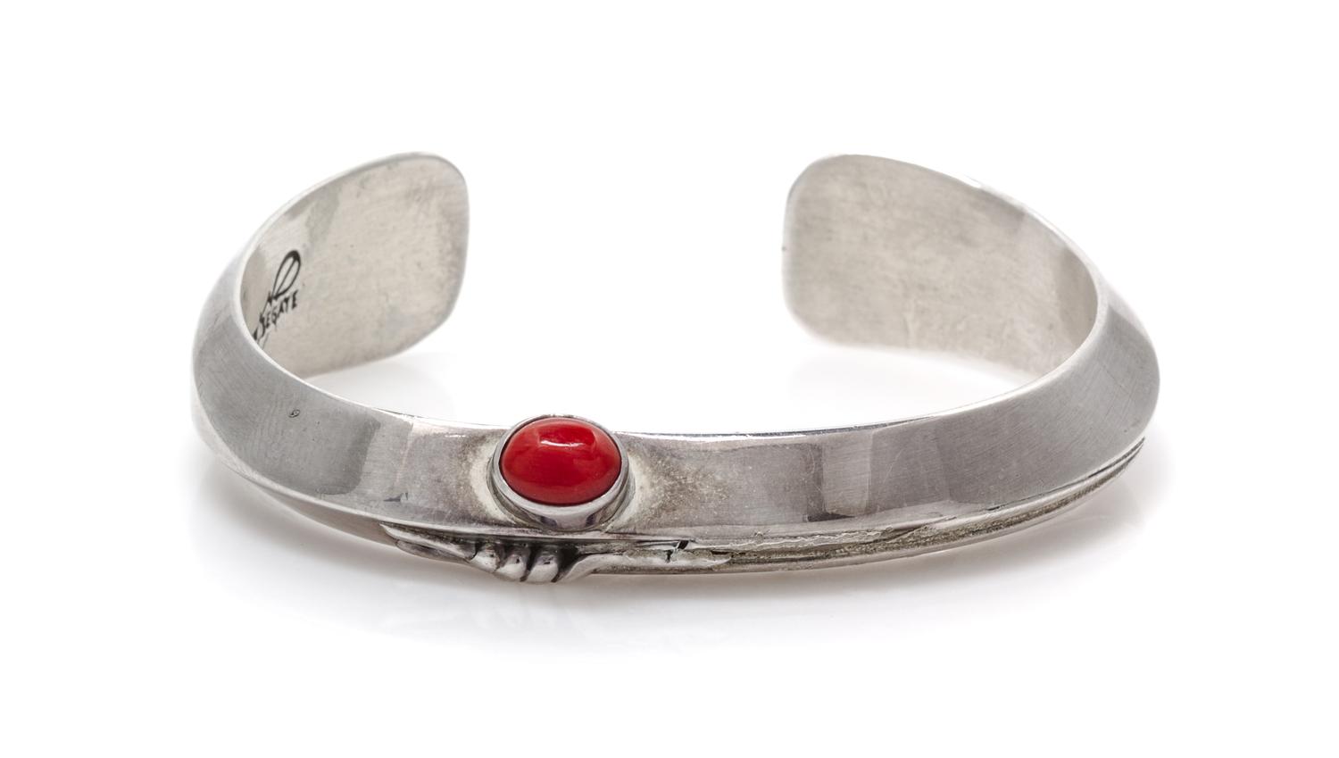 A Sterling Silver and Coral Cuff Feather Motif Cuff Bracelet, Ben Begay, Navajo, 30.20 dwts.