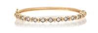 A 14 Karat Yellow Gold and Diamond Hinged Bangle Bracelet, 10.40 dwts.