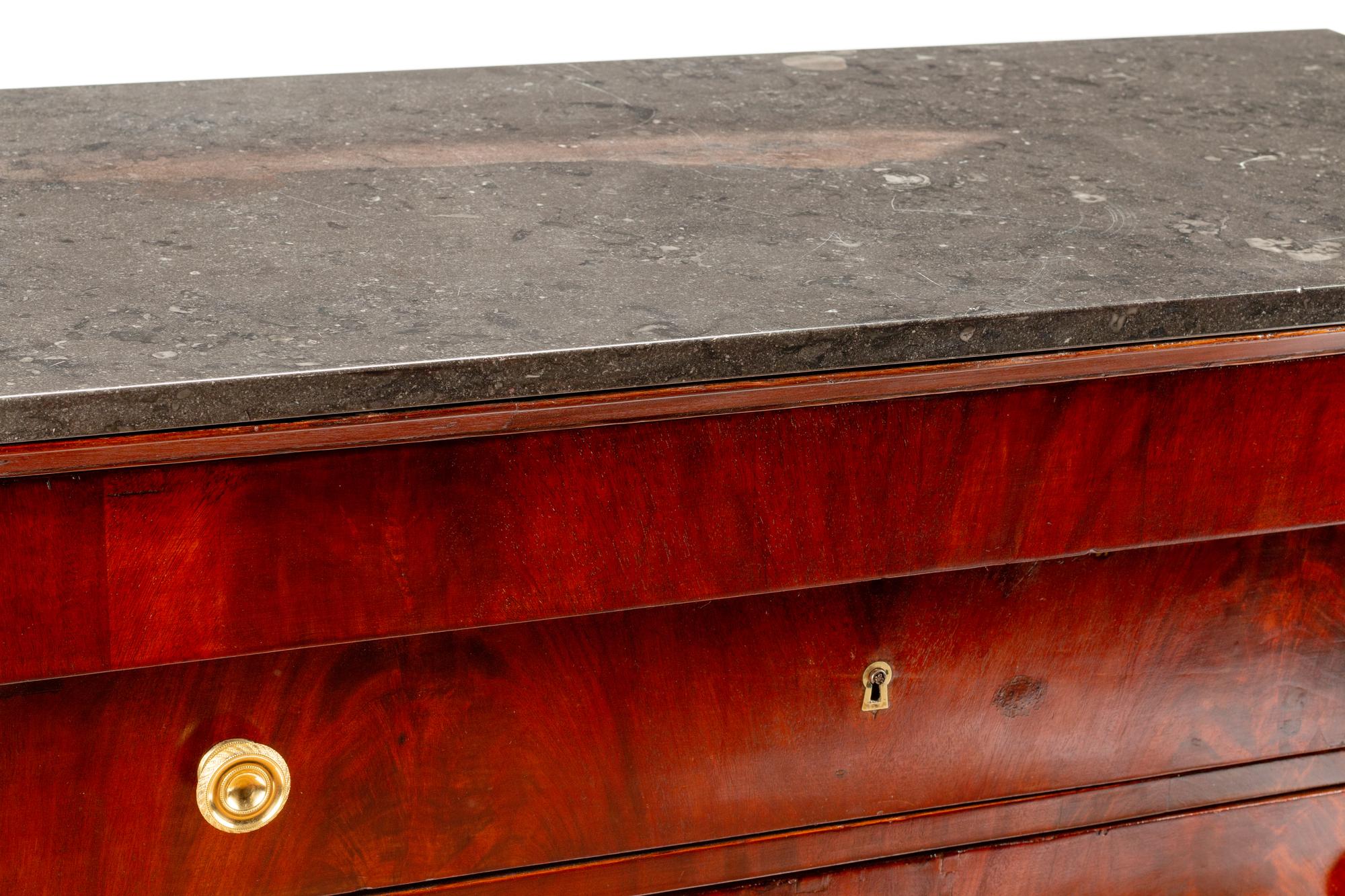 An Empire Style Gilt Bronze Mounted Mahogany Marble-Top Commode