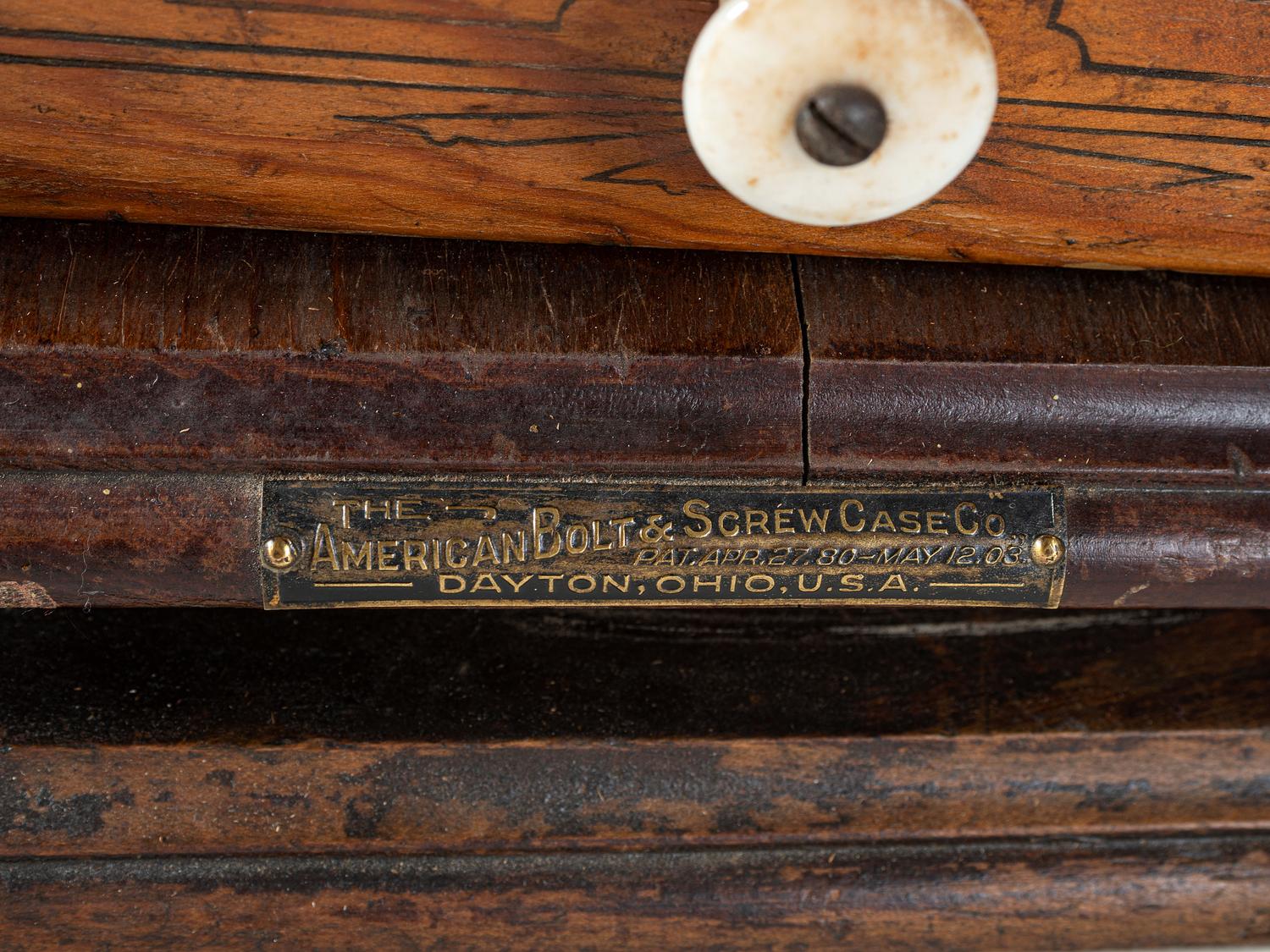 An American Bolt and Screw Case Company Stenciled Pine Octagonal Rotating Cabinet