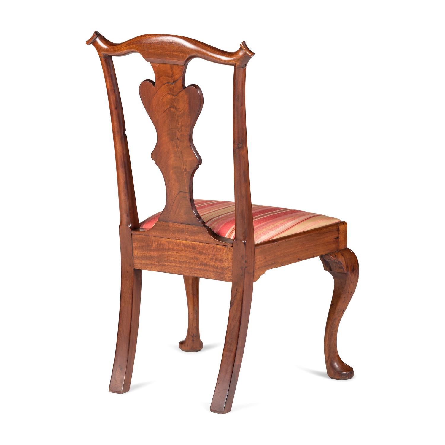 A Queen Anne Carved and Figured Walnut Side Chair