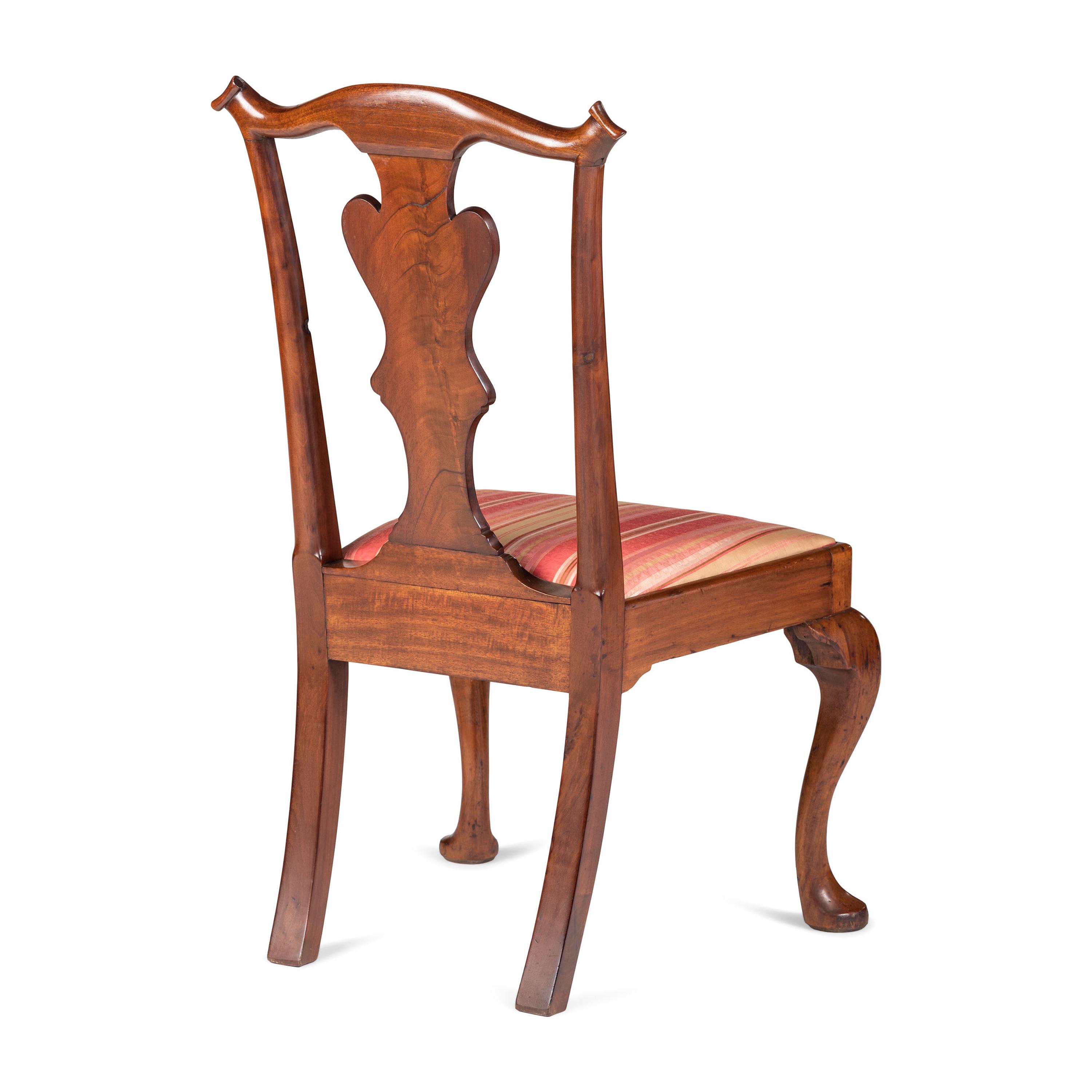 A Queen Anne Carved and Figured Walnut Side Chair