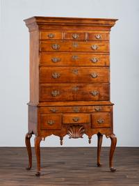 A Queen Anne Shell-Carved and Figured Maple Flat-Top High Chest of Drawers