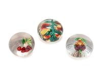A Five Pears Glass Paperweight, a Bundle of Cherries Glass Paperweight and a Pansy Glass Paperweight