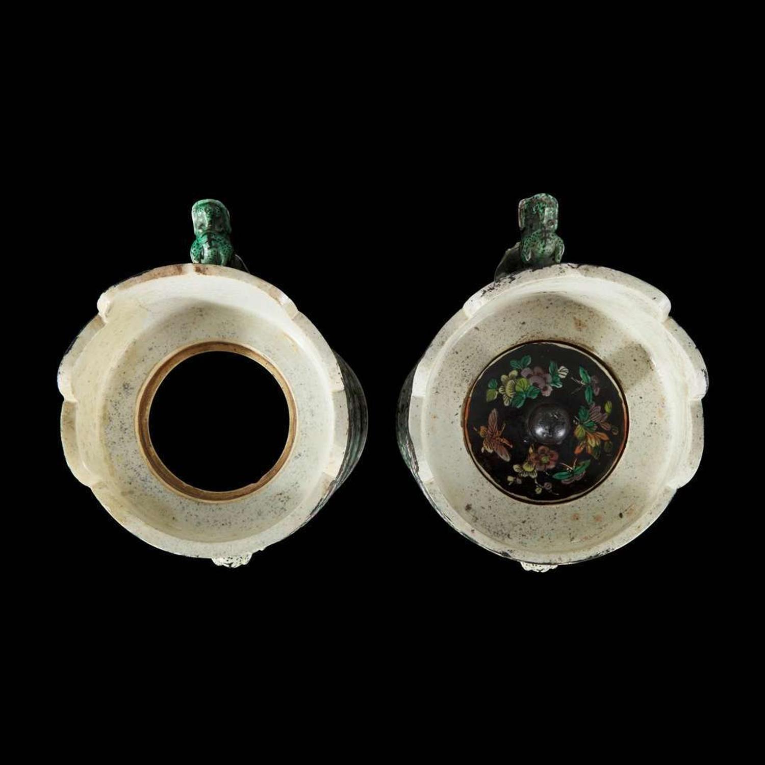 An associated pair of Chinese famille noir-decorated porcelain ceremonial ewers 黑地瓷胎画珐琅多穆壶两只 或为一对 Qing dynasty ?