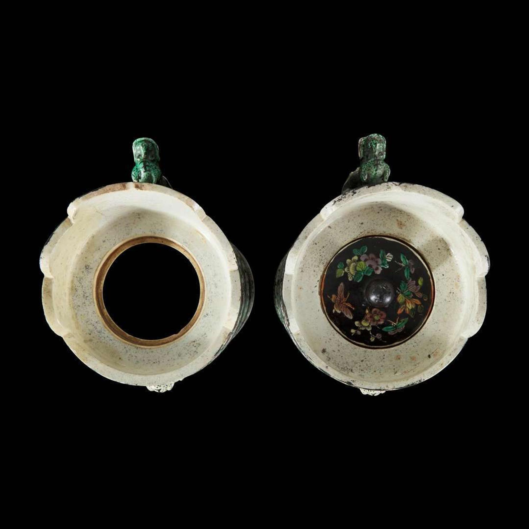 An associated pair of Chinese famille noir-decorated porcelain ceremonial ewers 黑地瓷胎画珐琅多穆壶两只 或为一对 Qing dynasty ?