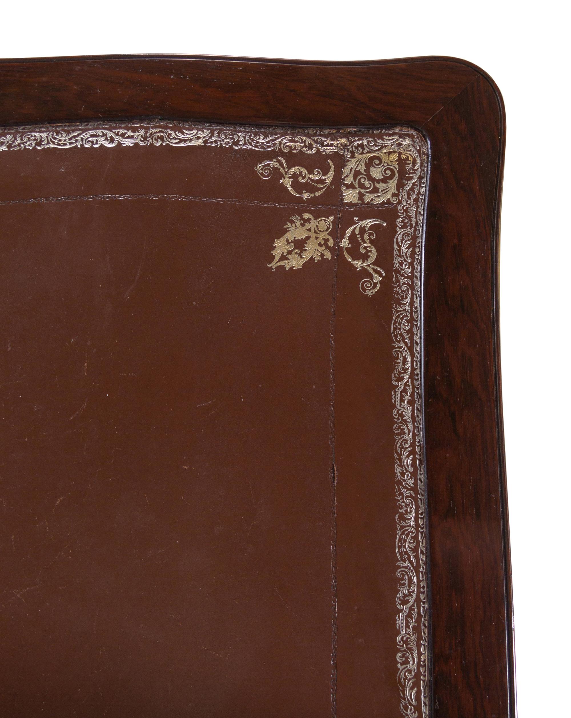 A Louis XV Style Gilt Bronze Mounted Tulipwood Flip-Top Writing Table