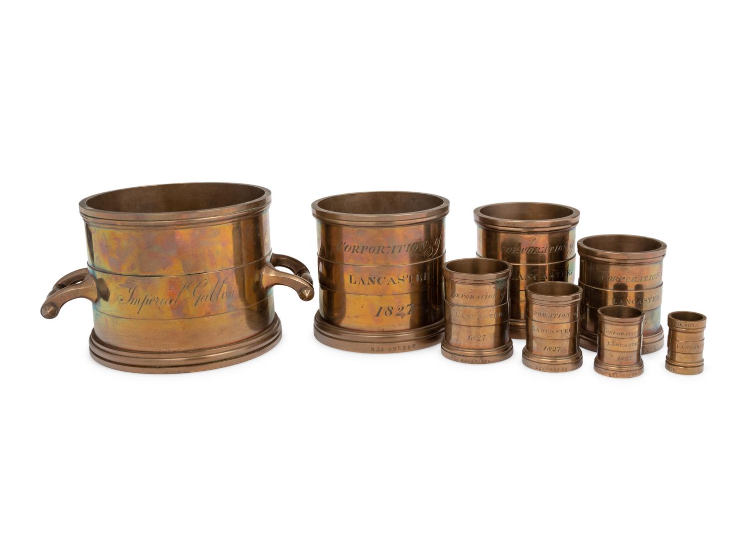 A Set of Eight English Brass Graduated Imperial Bushel Measures