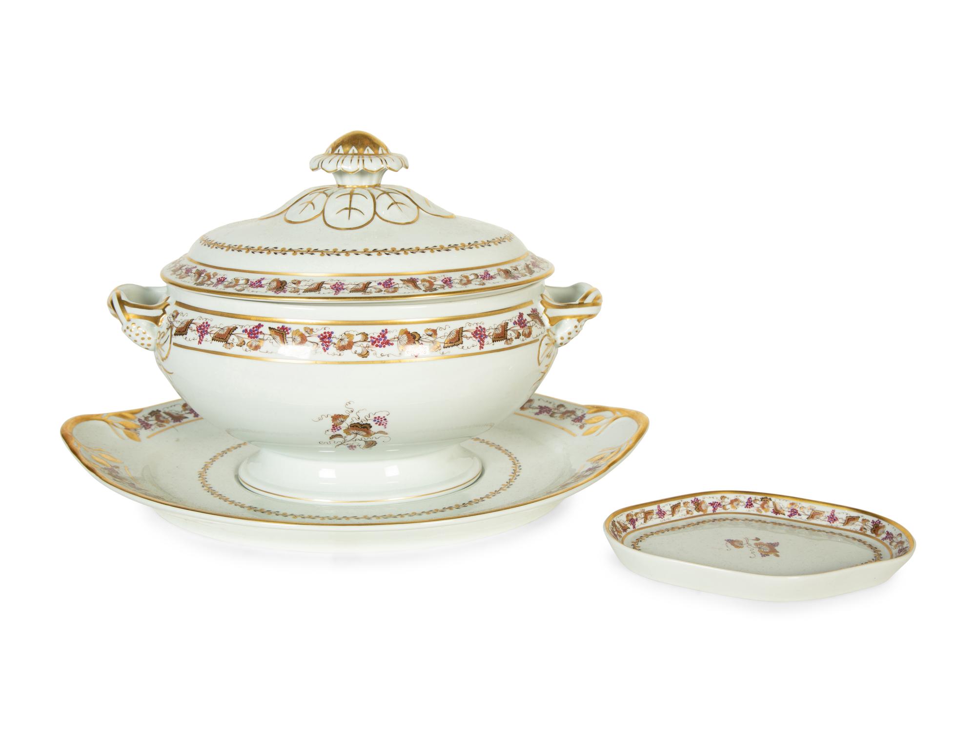 A Mottahedeh Porcelain Tureen, Underplate, and Spoon Rest