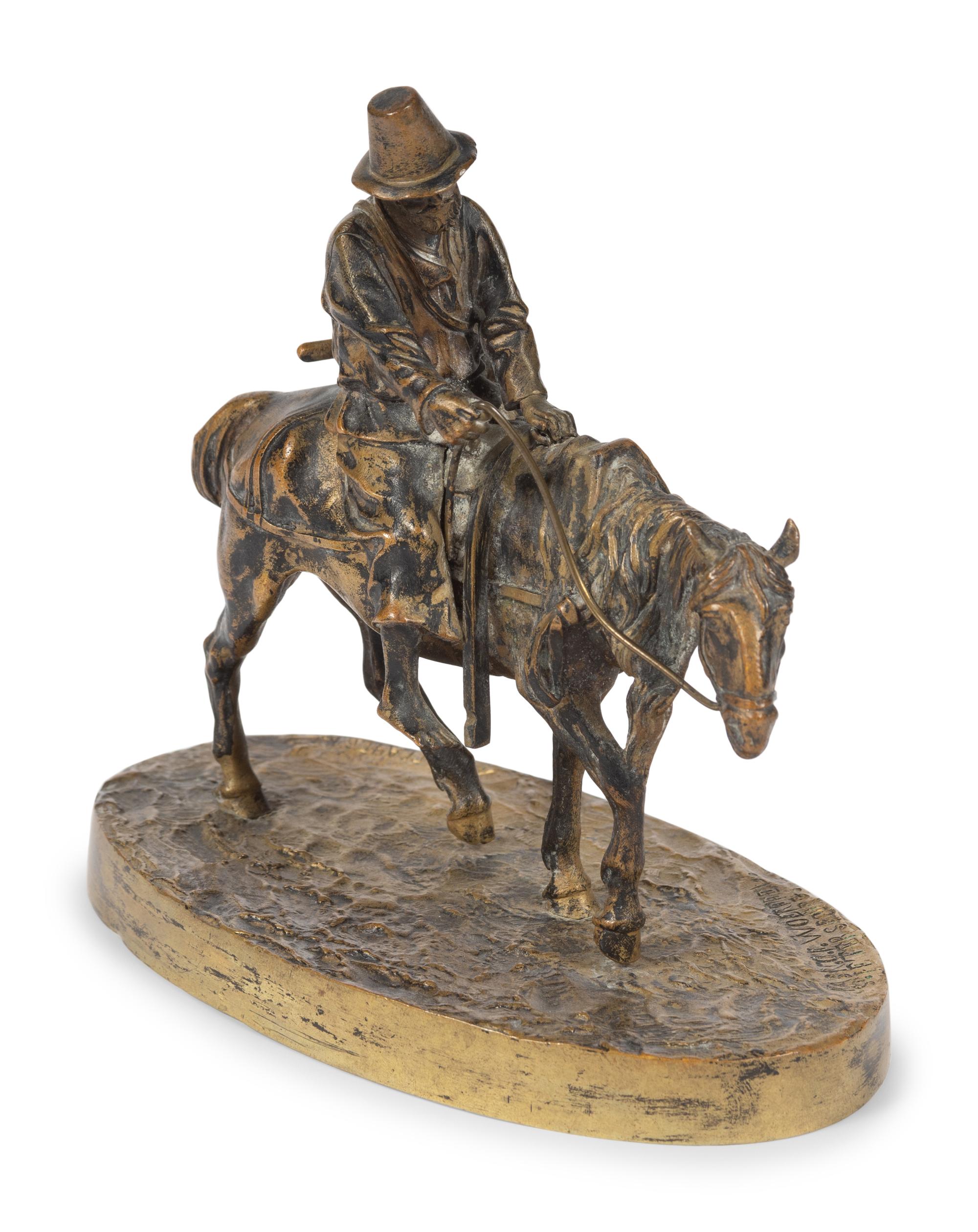 A Russian Gilt Bronze Figural Group of a Man on Horseback