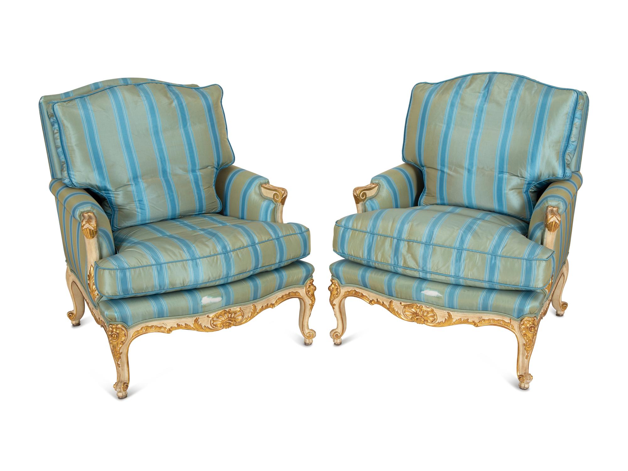A Pair of Louis XV Style Painted and Parcel Gilt Bergeres