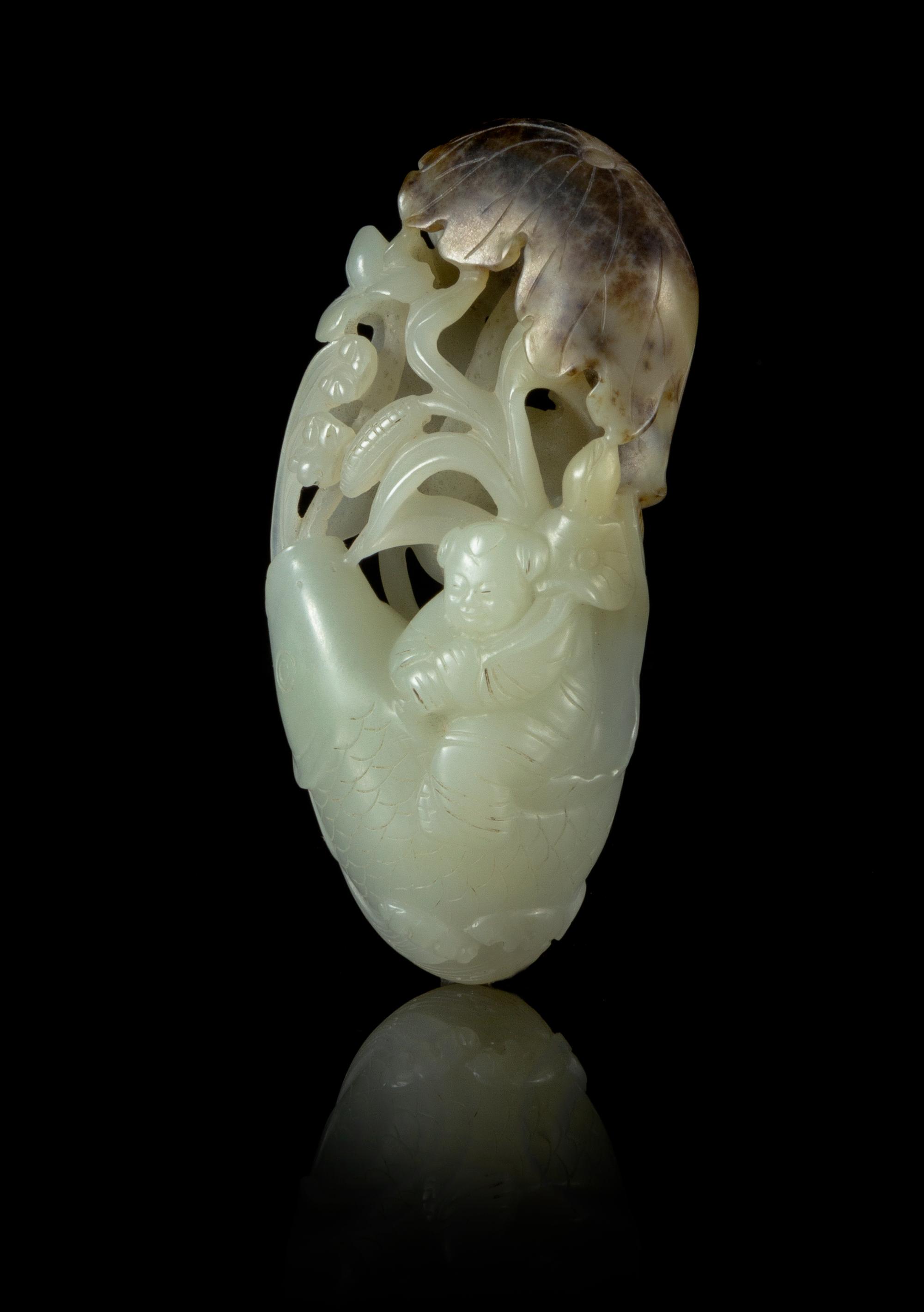 A Carved Celadon Jade Toggle Length 3 1/2 inches.