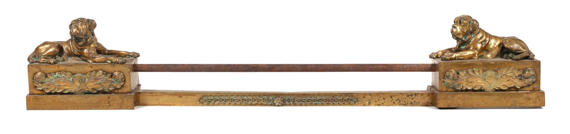 A Pair of Brass Mastiff Chenets Width 13 1/2 inches.