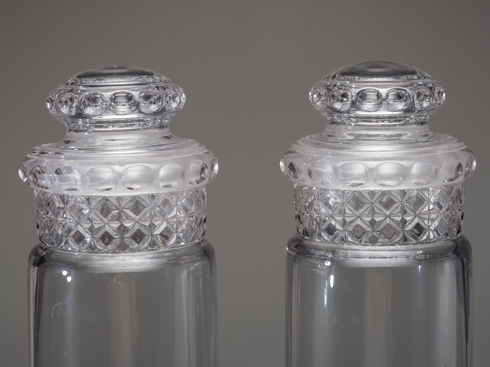 Eight Molded Glass Display Jars