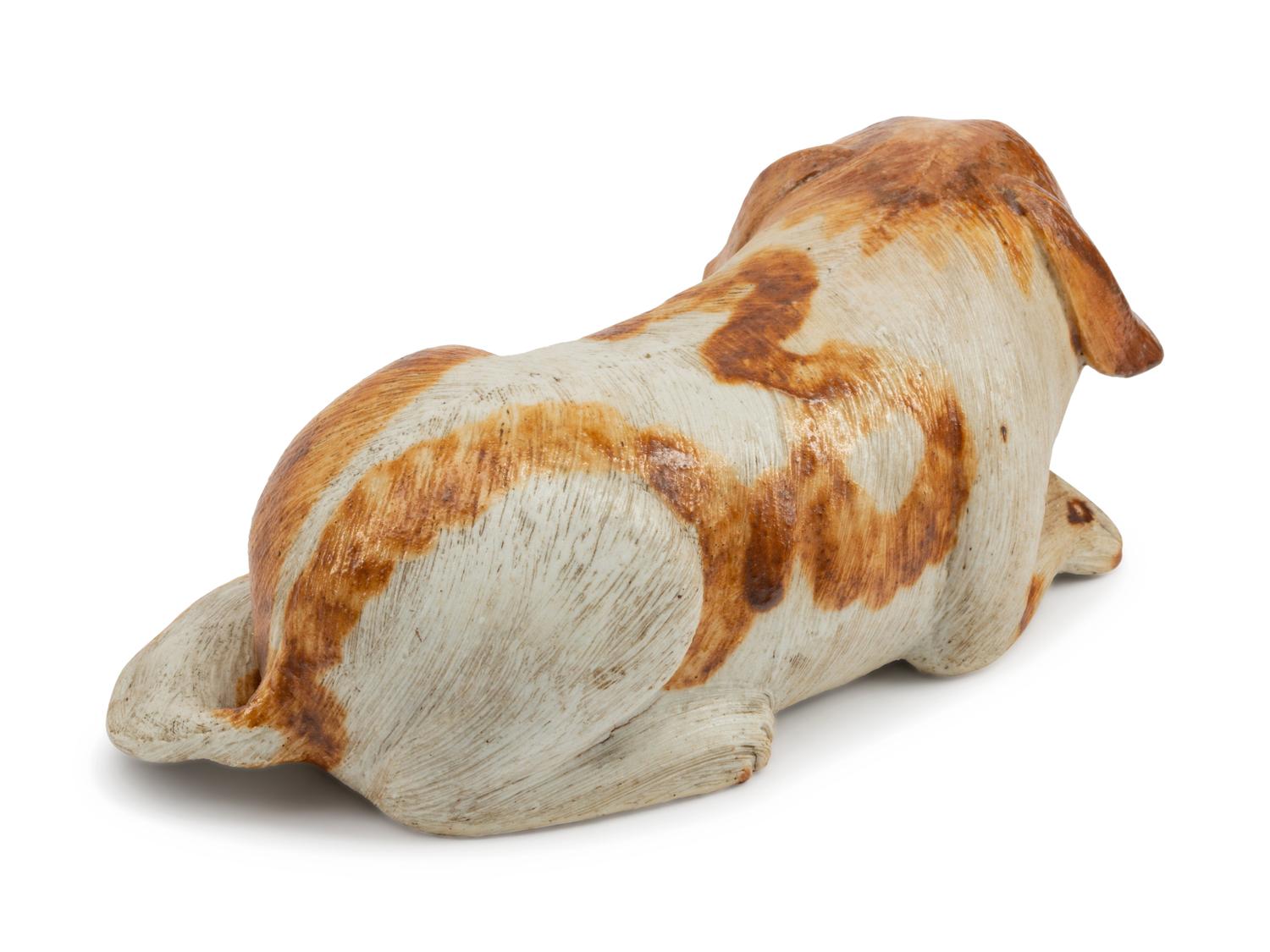 A Chinese Export Porcelain Figure of a Recumbent Dog — 19TH CENTURY