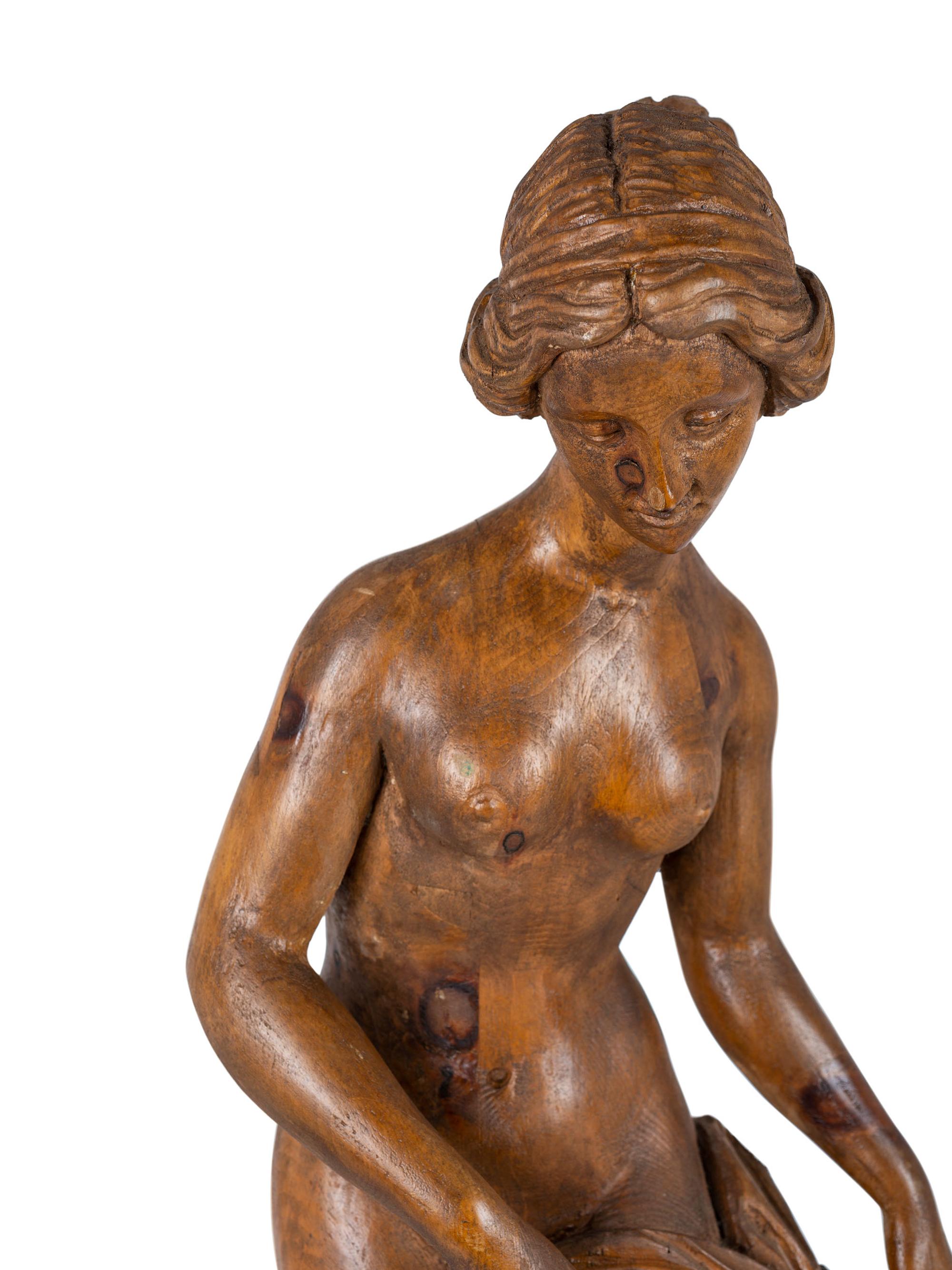 A Classically Inspired Carved Wooden Sculpture of a Standing Nude Female