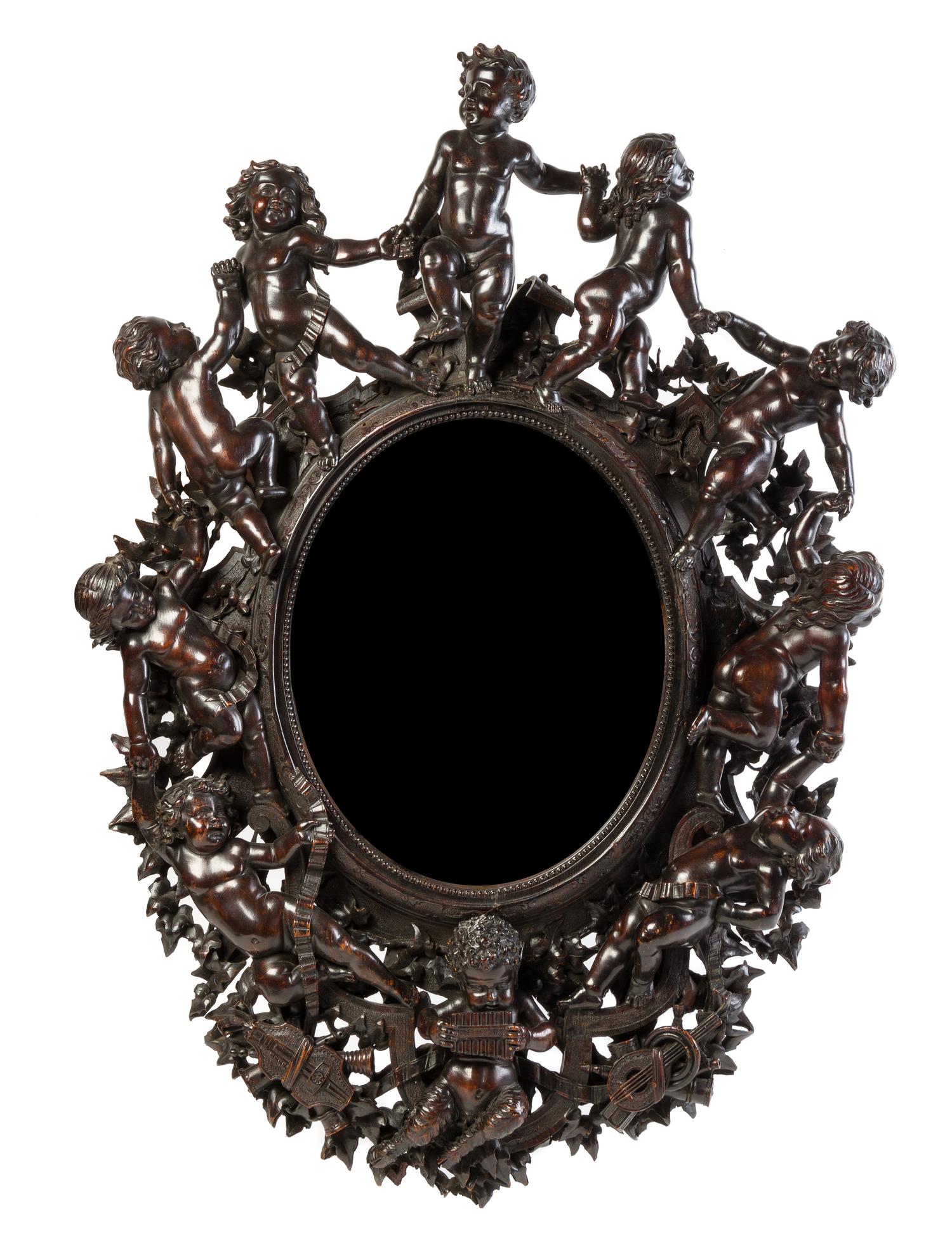 A Venetian Carved Walnut Mirror Height 39 1/2 x width 26 3/4 inches. — VALENTINO PANCIERA BESAREL (1829-1902)