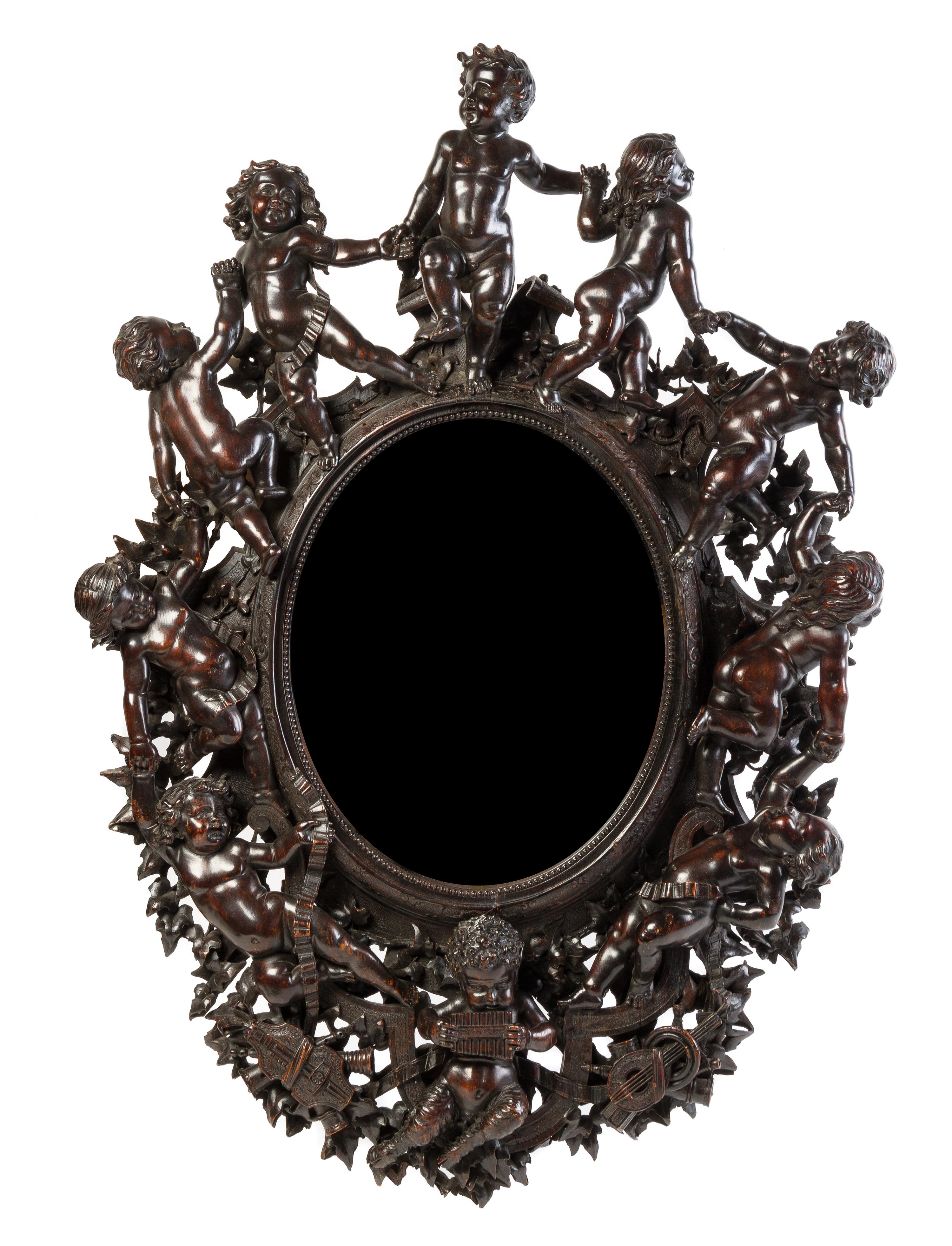A Venetian Carved Walnut Mirror Height 39 1/2 x width 26 3/4 inches. — VALENTINO PANCIERA BESAREL (1829-1902)