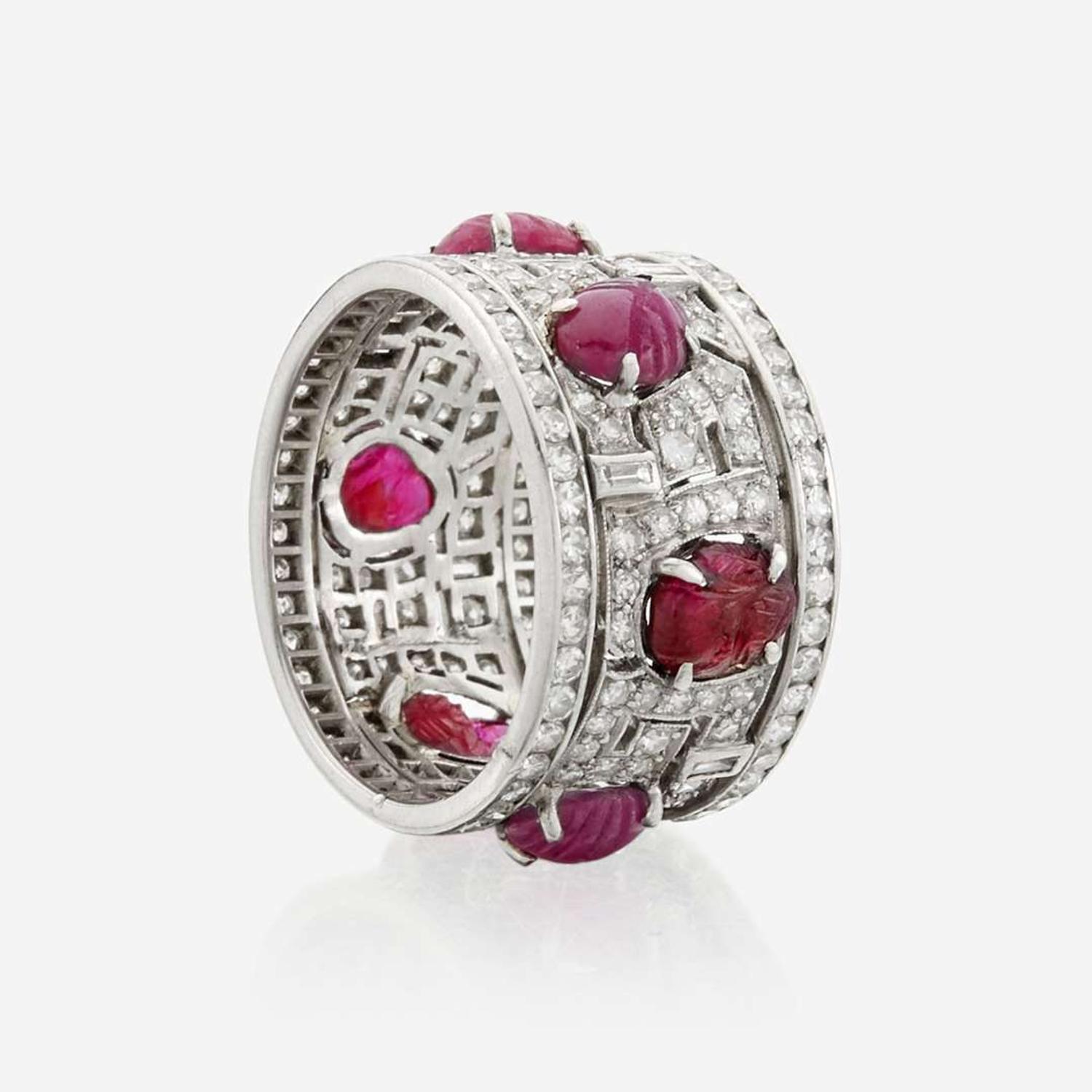 An Art Deco diamond, ruby, and platinum wide band