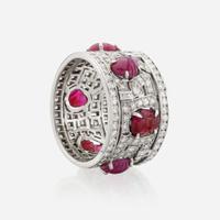 An Art Deco diamond, ruby, and platinum wide band