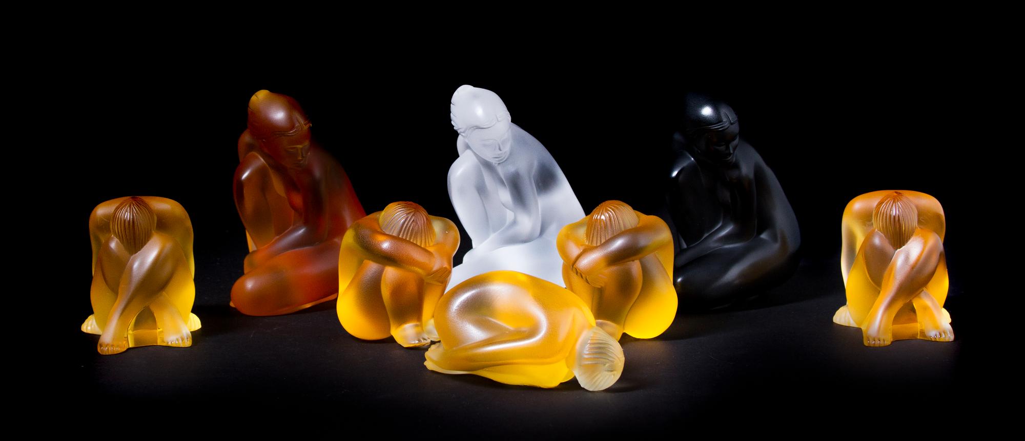 Eight Lalique Molded and Frosted Glass Figures, Height of tallest 4 1/8 inches.