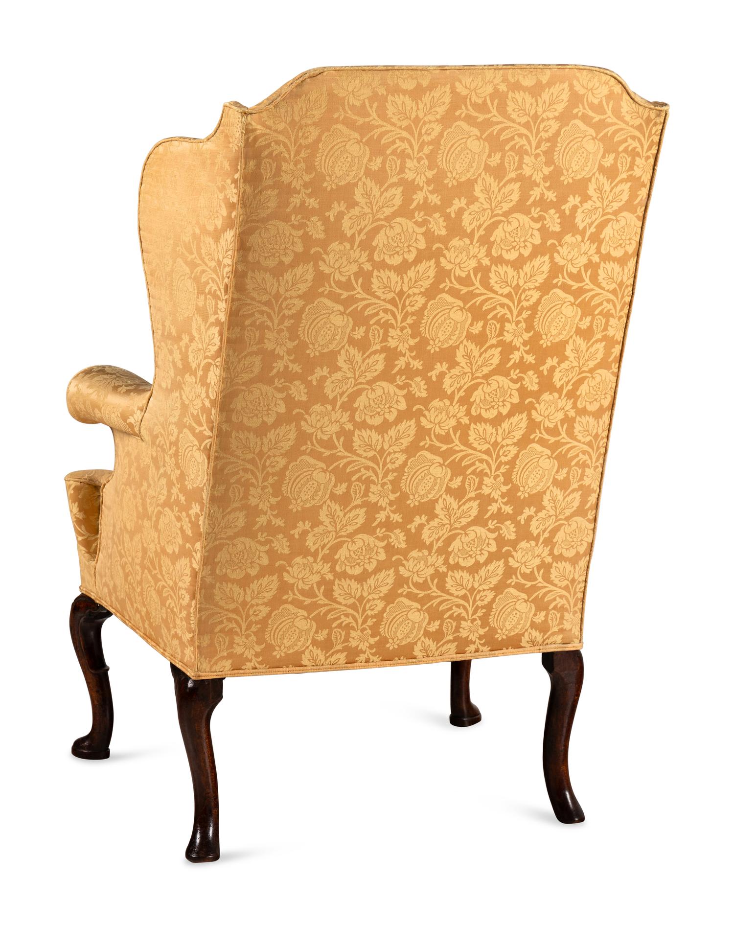 A George I Walnut Wingback Armchair