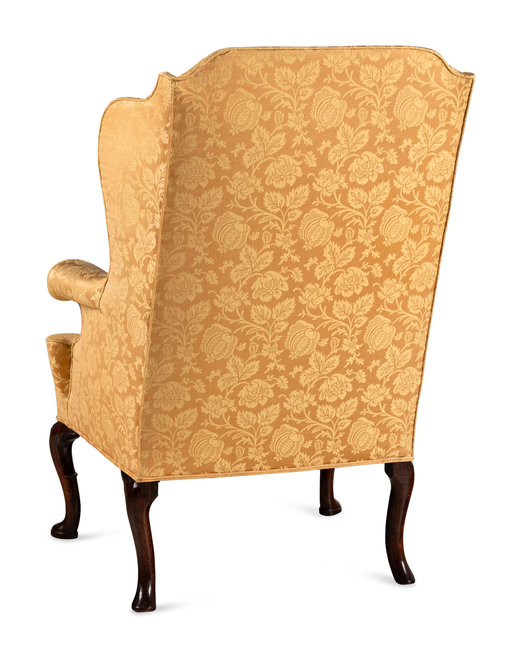 A George I Walnut Wingback Armchair