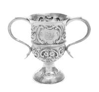 A George III Silver Loving Cup, Hester Bateman, London, 1789, worked in repousse to show C-scrolls and floral blossoms, raised on a cir