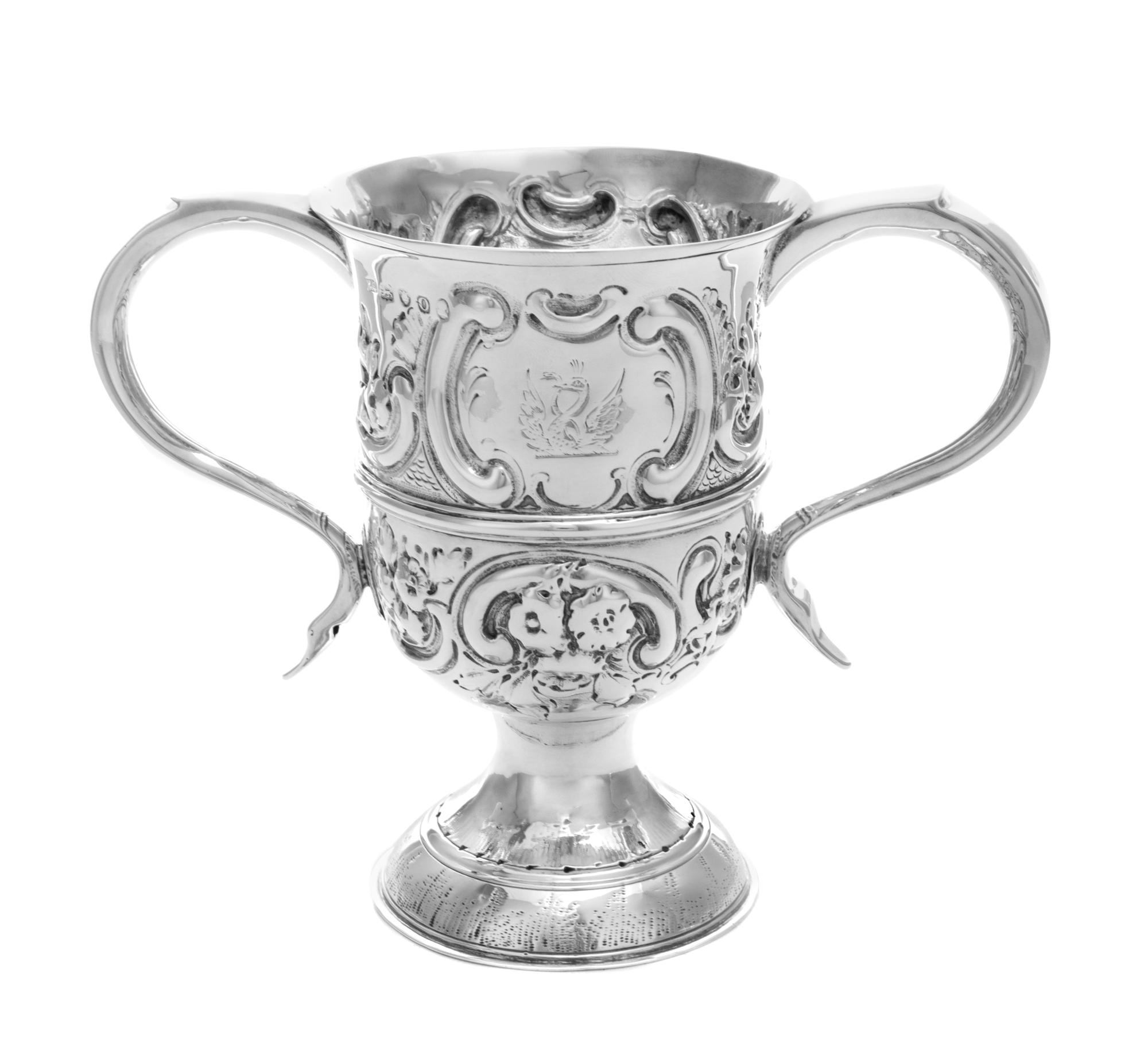 A George III Silver Loving Cup, Hester Bateman, London, 1789, worked in repousse to show C-scrolls and floral blossoms, raised on a cir