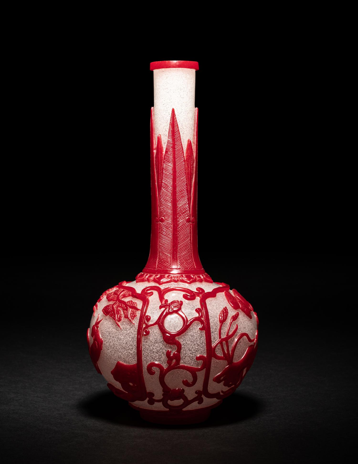 A Chinese Red Overlay Snowflake Ground Peking Glass Bottle Vase