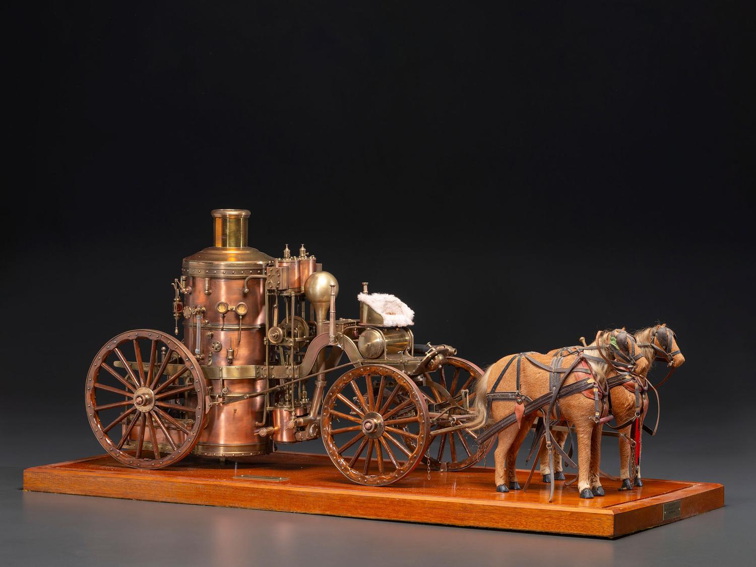 A Copper and Wood Horse-Drawn Steam-Powered Fire Engine Model