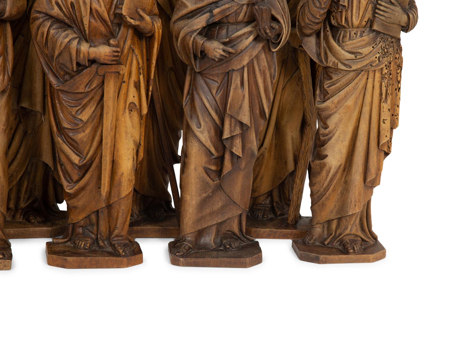 A Set of Twelve Continental Carved Walnut Figures of Apostles
