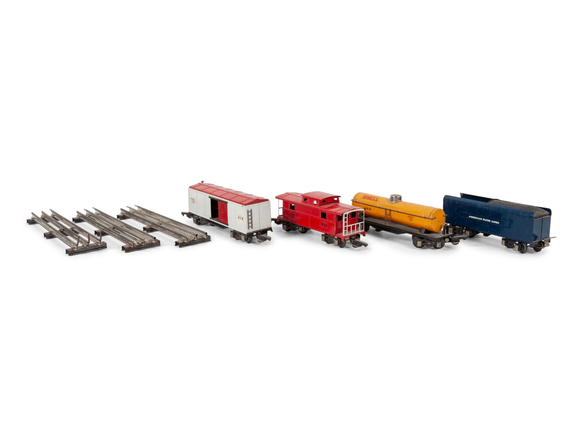 A Lionel 385E Loco Engine and Tender, Three Lionel Train Cars, Four American Flyer Line Cars and Other Accessories