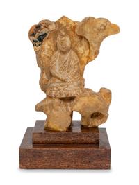 A Chinese Carved Stone Figure of Buddha